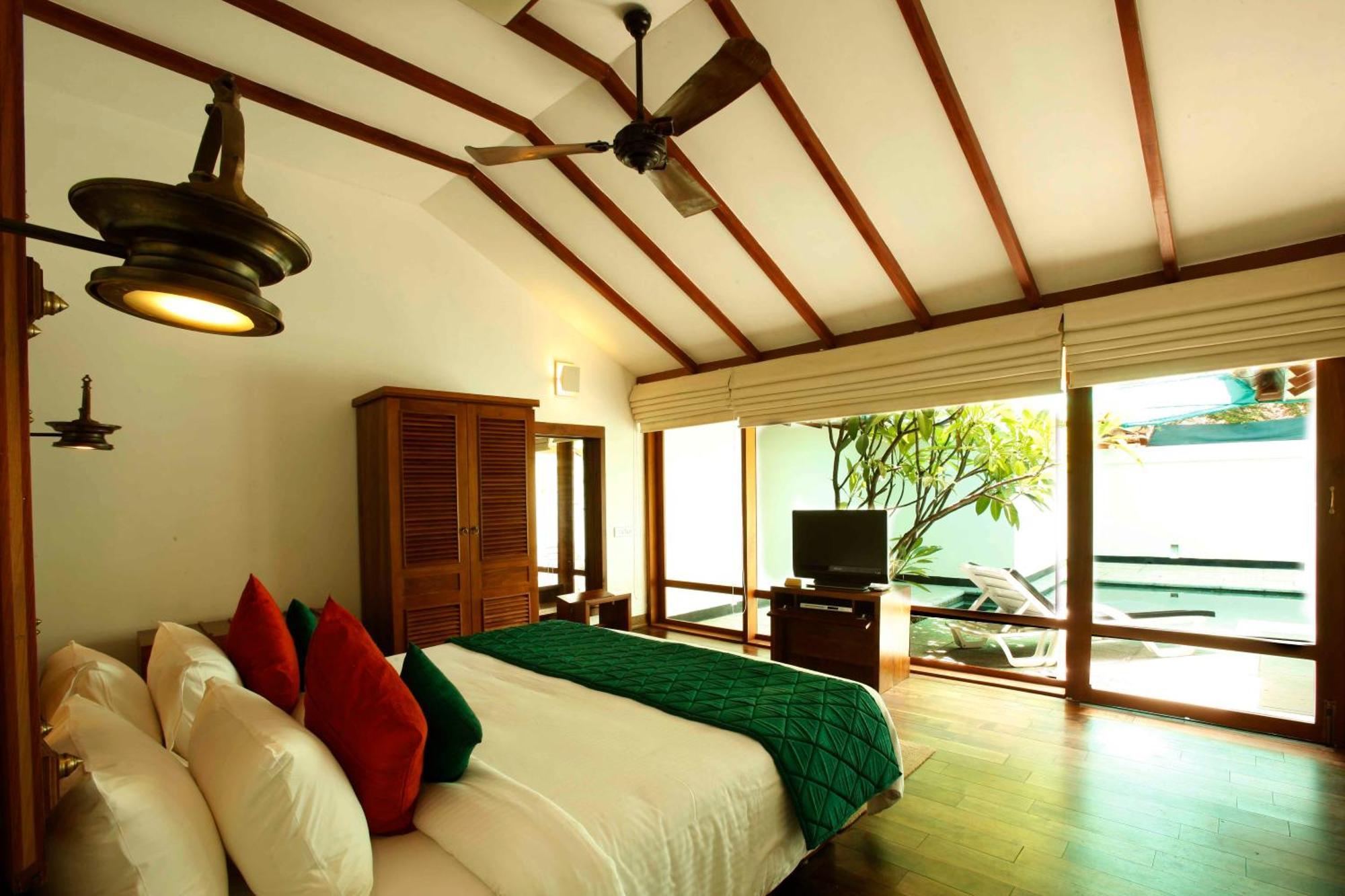 Heritage Madurai Cameră foto A bedroom at the resort