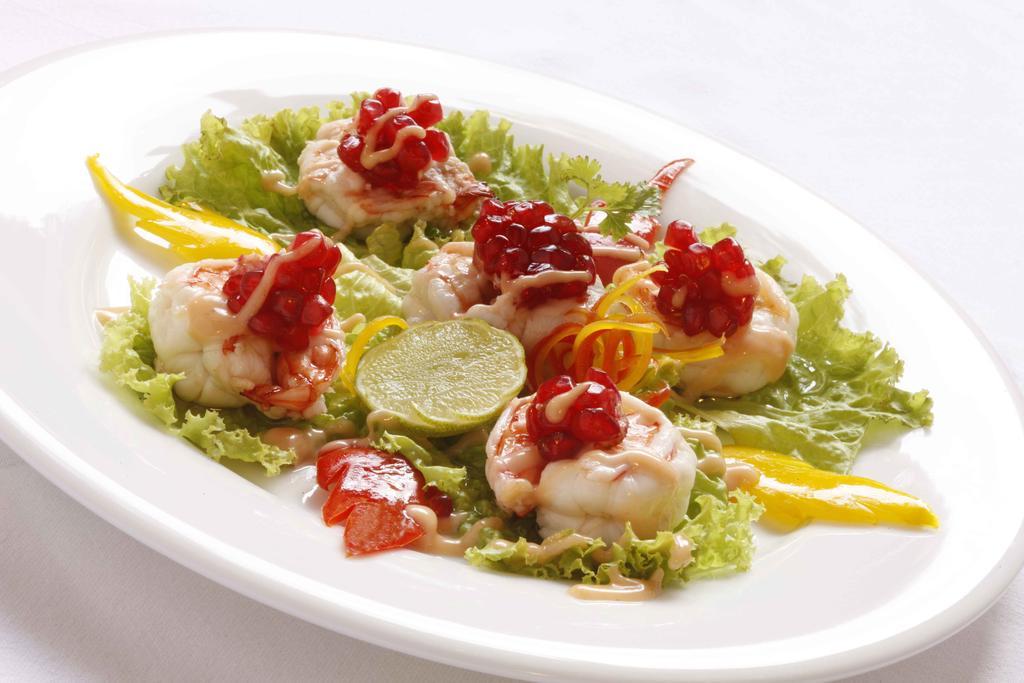 Heritage Madurai Exterior foto A salad of scallops